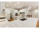 Modern kitchen with white cabinets, quartz counters and island at 6202 Talmadge Nw Way, Acworth, GA 30101