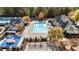 Community pool with adjacent clubhouse and playground at 6202 Talmadge Nw Way, Acworth, GA 30101