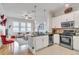 A stylish living space with stainless steel appliances and an open floor plan at 3621 Vinings Slope Se # 1537, Atlanta, GA 30339
