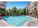 Resort-style pool with lounge chairs and umbrellas creating a relaxing oasis at 3621 Vinings Slope Se # 1537, Atlanta, GA 30339