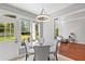 Kitchen breakfast nook with glass table and backyard view at 3545 Silver Vista Ct, Cumming, GA 30041