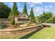 Chattahoochee River Club entrance with stonework and landscaping at 3545 Silver Vista Ct, Cumming, GA 30041