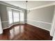 Bright dining room with hardwood floors and elegant chandelier at 3545 Silver Vista Ct, Cumming, GA 30041