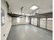 Spacious garage with overhead storage and epoxy flooring at 3545 Silver Vista Ct, Cumming, GA 30041