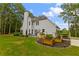 House exterior showcasing a deck, raised garden beds, and lush landscaping at 3545 Silver Vista Ct, Cumming, GA 30041