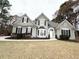 Two-story house with stucco exterior and landscaping at 3545 Silver Vista Ct, Cumming, GA 30041