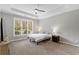 Large main bedroom with ceiling fan and large window at 3545 Silver Vista Ct, Cumming, GA 30041