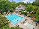 Resort-style pool with lounge chairs and clubhouse at 3545 Silver Vista Ct, Cumming, GA 30041