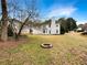 Expansive backyard featuring a fire pit and lots of space for outdoor activities at 1615 Cheshire Ct, Lawrenceville, GA 30043