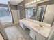 Bathroom featuring a large double vanity with a large mirror, bath tub and shower at 1615 Cheshire Ct, Lawrenceville, GA 30043