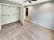 Bedroom featuring new carpet, an open closet, fresh neutral gray paint, and an ensuite at 1615 Cheshire Ct, Lawrenceville, GA 30043