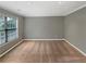 Bedroom with carpet floors, gray walls, and natural light showcases a cozy and inviting atmosphere at 1615 Cheshire Ct, Lawrenceville, GA 30043