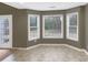 Bright breakfast nook featuring bay windows that provide backyard views at 1615 Cheshire Ct, Lawrenceville, GA 30043