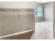 Spacious walk-in closet featuring tan carpeting and built-in shelving at 1615 Cheshire Ct, Lawrenceville, GA 30043