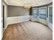 Spacious dining room showcasing a bay window, elegant chandelier, carpet flooring, and neutral gray wall color at 1615 Cheshire Ct, Lawrenceville, GA 30043