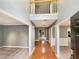Grand foyer with hardwood flooring, tall ceilings, and access to multiple rooms, creating an inviting entrance at 1615 Cheshire Ct, Lawrenceville, GA 30043