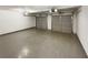 Attached garage with two bays, painted floor, and overhead lighting at 1615 Cheshire Ct, Lawrenceville, GA 30043