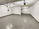 Attached garage with painted floor, and overhead lighting at 1615 Cheshire Ct, Lawrenceville, GA 30043