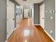 Long hallway with hardwood floors leads to front door and other rooms at 1615 Cheshire Ct, Lawrenceville, GA 30043