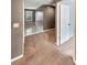 Upstairs hallway featuring fresh neutral paint, carpet, and a view of a bedroom with a doorway at 1615 Cheshire Ct, Lawrenceville, GA 30043