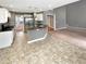 Updated kitchen flows into living space, featuring granite countertops and stainless steel appliances at 1615 Cheshire Ct, Lawrenceville, GA 30043