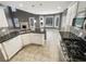 Open kitchen layout with granite countertops and stainless steel appliances at 1615 Cheshire Ct, Lawrenceville, GA 30043
