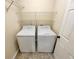 Laundry room featuring a washer, dryer, and shelving at 1615 Cheshire Ct, Lawrenceville, GA 30043