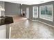 Bright breakfast nook with a view to the living room with fireplace at 1615 Cheshire Ct, Lawrenceville, GA 30043