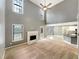 Open floor plan connecting the living room and kitchen area, with a fireplace feature at 1615 Cheshire Ct, Lawrenceville, GA 30043