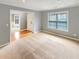 Cozy living room with carpet flooring, gray walls, and natural light flowing from the windows and visible front door at 1615 Cheshire Ct, Lawrenceville, GA 30043