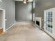 Spacious living room with fireplace, tall ceilings, a ceiling fan, and ample natural light at 1615 Cheshire Ct, Lawrenceville, GA 30043