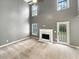 Bright living room features high ceilings, a fireplace, and lots of natural light at 1615 Cheshire Ct, Lawrenceville, GA 30043