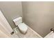 Close-up of a powder room with tiled flooring and a modern toilet at 1615 Cheshire Ct, Lawrenceville, GA 30043