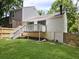 Backyard view featuring a deck, a fenced yard and a partial view of the house at 2035 Marbut Trce, Lithonia, GA 30058