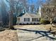 Inviting one-story home with a concrete driveway and complemented by mature trees at 2035 Marbut Trce, Lithonia, GA 30058