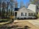 Charming one-story home featuring classic shutters, manicured landscaping, and a cozy front porch at 2035 Marbut Trce, Lithonia, GA 30058