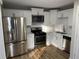 Modern kitchen with stainless steel appliances and white cabinets at 2035 Marbut Trce, Lithonia, GA 30058