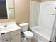 Bathroom with tub, toilet, and white vanity at 650 Providence Sw Pl, Atlanta, GA 30331