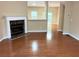 Spacious living room with hardwood floors and a corner fireplace at 650 Providence Sw Pl, Atlanta, GA 30331