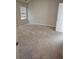 Empty bedroom provides ample space with soft carpeting and a bright window view at 958 Fellowship Rd, Fairburn, GA 30213