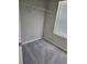 Bedroom closet with shelf, gray walls, blinds, and gray carpet flooring at 958 Fellowship Rd, Fairburn, GA 30213