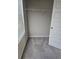 Bedroom closet with shelf, gray walls, blinds, and gray carpet flooring at 958 Fellowship Rd, Fairburn, GA 30213