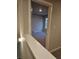 Upstairs hallway leading to a bedroom featuring carpeted floors at 958 Fellowship Rd, Fairburn, GA 30213