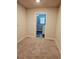 Neutral carpeted room with doorway to a laundry room with a washer at 958 Fellowship Rd, Fairburn, GA 30213