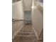 Carpeted stairway leading down to a lower level at 958 Fellowship Rd, Fairburn, GA 30213