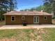 Exterior view of the house's back featuring a patio and grassy area at 5942 Rock Court #5, Union City, GA 30291