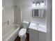 Well-lit bathroom features a shower-tub combination and a single sink vanity at 5942 Rock Court #5, Union City, GA 30291