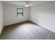 Bedroom with carpet, a ceiling fan and a large window provides ample natural light at 5942 Rock Court #5, Union City, GA 30291