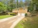 Two story home with two car garage, driveway and yard at 5942 Rock Court #5, Union City, GA 30291