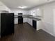 An eat-in kitchen with white cabinetry and black appliances at 5942 Rock Court #5, Union City, GA 30291